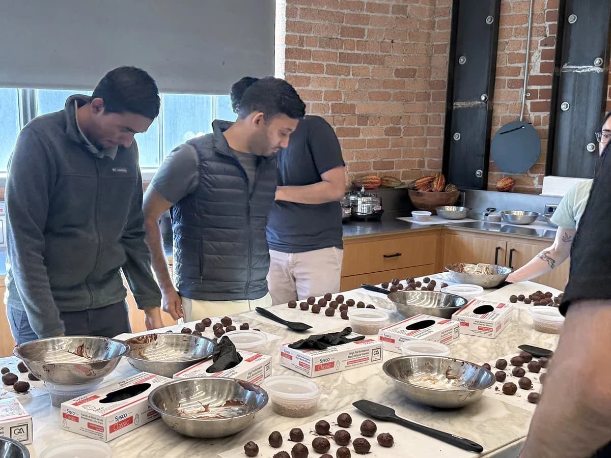Team members making chocolate truffles